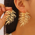 Golden oversized tropical leaf earrings with textured wrinkles and bohemian holiday style - Large Gold Leaf Earring Style (M-441)