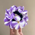 Handheld purple and white frangipani flower elastic hair tie with yellow centers - Purple Hibiscus Scrunchie
