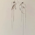 Detail view of silver leaf tassel earrings with black beads on a display stand - Silver Leaf Tassel Earrings (Silver Earring Post) E2455