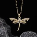 Macro shot of gold dragonfly pendant necklace with sparkling cubic zirconia on dark stone - Style F-Gold Zirconia Black Eyes