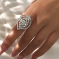 Detailed close-up of a glamorous silver marquise pavé ring with sparkling crystals on hand - Adjustable Open / Silver Leaf Style (6011S)