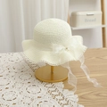 Close-up of kids straw hat with silk ribbon bow pearl detail and lace trim edge - 52cm (Recommended 2-6 Years) / Off-white Hat