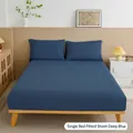 Solid deep blue fitted bed sheet and pillowcase set in a minimalist bedroom - Dark Blue