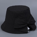 Detailed view of a black grid pattern bucket hat featuring a large decorative side bow - M (56-58cm) / Black