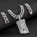 Silver iced-out Cuban chain set with Jesus head pendant on black leather background - 20-inch Cuban Chain Set / Silver