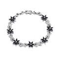 Detail of silver chain bracelet with black zircon floral charm and sparkling crystal link - Black