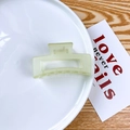 Matte mint green square hair claw clip with rectangular cutout on white plate - Jelly Yellow