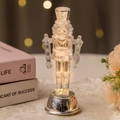 Transparent nutcracker king statue on a silver LED light base for Christmas decor - Nutcracker Style D