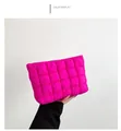 Detail of rose red quilted envelope bag with padded texture and metallic zip closure - Rose Red