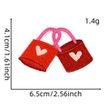Detail view of heart-shaped shopping bag embroidery patch with dimensions 6.5x4.1cm - Style 16 (Red Heart Bag)