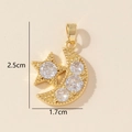 Detailed view of gold star moon pendant with cubic zirconia inlay measuring 2.5cm by 1.7cm - G-Moon Star Pendant