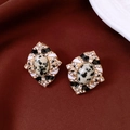 Detail of vintage diamond-shaped stud earrings with gold frame and spotted oval stone inlay - Oval Spotted Stone Texture Style / Silver Earring Post - Gold - Black