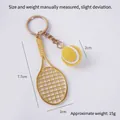 Miniature tennis racket keychain in gold finish with a small yellow fuzzy tennis ball charm - 2cm Small Yellow Tennis Ball + Gold Racket