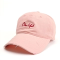Detail of pink cotton baseball cap with red New York embroidery and distressed brim - Pink