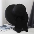 Close-up of black woven straw hat featuring a vintage chiffon bow and long ribbons - M (56-58cm) / Black