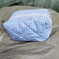 Quilted blue and white checkered travel toiletry bag with white zipper closure - Blue Plaid