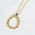 Golden teardrop necklace with blue center gemstone and colorful stones on a fine chain - Hollow Waterdrop Zirconia