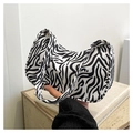 Detailed close-up of the black and white zebra print fabric on this trendy canvas bag - Zebra