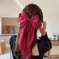 Elegant oversized dark red satin bow hair clip for women styled on a ponytail - Scarf Bow / Burgundy