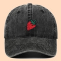 Washed black cotton baseball cap featuring embroidered strawberry on the front - Adjustable / Black