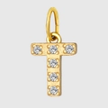 Detailed macro view of a gold T-letter pendant encrusted with sparkling cubic zirconia - Letter T
