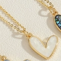 Golden heart pendant necklace with white mosaic shell inlay and intricate details - White
