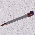 Detailed shot of rose gold metal pen encrusted with colorful crystals and purple top - Dark Amethyst