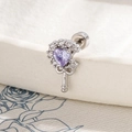 Silver earring with purple heart stone and clear cubic zirconia in key design - Purple