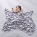 Breathable muslin baby blanket with polar bear pattern shown in a soft nursery setting - Polar Bear