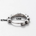 Macro detail of men's skull huggie earring showing 1.2cm diameter and 0.27cm thickness - Wrapped Skull Style (S93)