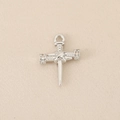 Macro shot of a silver cross pendant with sword elements and small inlaid gemstones - Pink Unicorn / 1.6*1.1cm / Silver