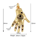Golden hand pendant with evil eye motif and micro-pave crystals dimensions 32x19mm - Constellation Eye Palm (L148657)