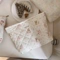 Detailed close-up of quilted floral cosmetic bag with dog print and simple wish label - Pink Floral Puppy