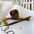 Detail of amber tortoiseshell claw clip on artistic white paper with star patterns - Butterfly Buckle Ribbon (Approx 12cm) / Matte Light Tortoise