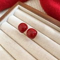 Macro detail of red enamel square stud earrings resting on a beige velvet jewelry box - 7# Red Glossy Square Stud Earrings