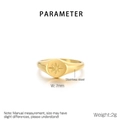 Detail view of a 7mm wide 18K gold plated stainless steel ring with star engraving - Gold