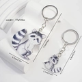 Wooden-style otter couple keychains in two sizes with realistic graphic and metal rings - Acrylic Raccoon Mother and Child 1 Pair