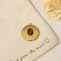 Vintage golden round pendant with tiger eye stone on a minimalist canvas bag background - Pendant Only (Without Chain)-Round Tiger Eye Radiant (SAC23061911)