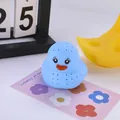 Blue duck-shaped silicone tea infuser with round filter holes on a floral card - Blue Bath Duck