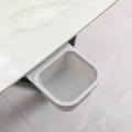 Grey rotating mini desktop trash can hanging under white marble desk for storage - Gray / Adhesive Style