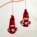 Set of two red knitted Santa ornaments with wooden heads for Christmas tree decoration - Two-Piece Set / Red Heart Boy and Girl