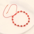 Handmade red stone beaded bracelet with golden spacers and bohemian braided cord - Red