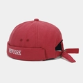 Detail of red Docker cap with white NEW YORK embroidery and adjustable metal buckle back - Adjustable / Burgundy