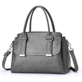 Detailed view of the dark grey faux leather texture and silver buckle on the crossbody bag - Dark Gray