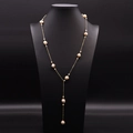 Elegant gold Y-shaped necklace with white freshwater pearls on a black jewelry bust - Long Sweater Chain