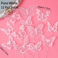Set of 12 elegant white hollow butterfly cake toppers for Queen Day party decor - PVC Butterfly AA Style (12 Pcs) / Pure White
