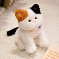 Adorable tricolor calico cat plush toy with orange ears and pink lace bib on soft rug - Calico Cat / 28cm (With Pink Checkered Bib)