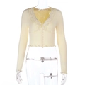 Detail of light yellow slim fit cropped cardigan with ruffled trim and deep V-neckline - S / Yellow