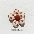 Detailed view of a 5.5cm plaid flower fabric patch with leopard print petals for DIY crafts - Off-white Heart