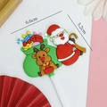 Weihnachts-Tortenstecker mit Weihnachtsmann und Rentier in einer grünen Geschenktüte - #6005 Weihnachtsmann und Rentier mit grüner Geschenktüte